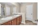 Bright bathroom featuring a double sink vanity and a separate shower and toilet area at 4964 Hay Bale Ct, Summerville, SC 29485