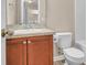 Neutral bathroom featuring a sink with wood cabinets, a toilet and a tub at 4964 Hay Bale Ct, Summerville, SC 29485