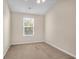 Comfortable bedroom with neutral paint, carpet, ceiling fan, and a bright window at 4964 Hay Bale Ct, Summerville, SC 29485