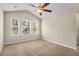 A bedroom features neutral paint, carpet, ceiling fan and windows at 4964 Hay Bale Ct, Summerville, SC 29485