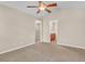A bedroom features neutral paint, carpet, a ceiling fan and access to a bathroom at 4964 Hay Bale Ct, Summerville, SC 29485
