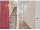 A bright foyer features wood flooring and a staircase leading to the second level at 4964 Hay Bale Ct, Summerville, SC 29485