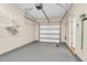 Clean garage interior featuring painted floor and ample storage shelving at 4964 Hay Bale Ct, Summerville, SC 29485