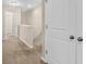 Upstairs hallway with neutral walls and carpet at 4964 Hay Bale Ct, Summerville, SC 29485