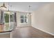 Bright kitchen with granite countertops, stainless steel sink, and a sunny dining area at 4964 Hay Bale Ct, Summerville, SC 29485