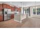 Spacious kitchen with wood cabinets, stainless appliances, granite counters, and a breakfast nook with large windows at 4964 Hay Bale Ct, Summerville, SC 29485