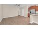 Open living space with wood flooring, neutral walls, and view into the kitchen at 4964 Hay Bale Ct, Summerville, SC 29485