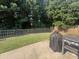 Fenced backyard showcasing a well-kept lawn and a grill, perfect for outdoor gatherings and activities at 5008 W W Liberty Meadows Dr, Summerville, SC 29485