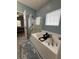Bright bathroom with a soaking tub, a glass shower, and patterned rugs at 5008 W W Liberty Meadows Dr, Summerville, SC 29485