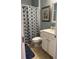 Clean bathroom featuring a decorative shower curtain, vanity, and wall mirror at 5008 W W Liberty Meadows Dr, Summerville, SC 29485