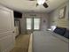 Serene bedroom with soft carpet, neutral walls, a comfortable bed, ample natural light, and stylish decor at 5008 W W Liberty Meadows Dr, Summerville, SC 29485