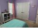 Comfortable bedroom with closet, soft carpet, and decoratively lit doorway at 5008 W W Liberty Meadows Dr, Summerville, SC 29485