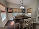 Cozy dining area with warm lighting and a stylish table set for six at 5008 W W Liberty Meadows Dr, Summerville, SC 29485