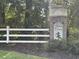 Sand Pines neighborhood sign with white fencing and lush greenery at 5008 W W Liberty Meadows Dr, Summerville, SC 29485