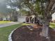 Charming home with a well-manicured front yard, inviting porch, swing, and mature trees at 5008 W W Liberty Meadows Dr, Summerville, SC 29485