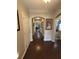 Inviting hallway with hardwood floors, arched doorway and tastefully decorated walls at 5008 W W Liberty Meadows Dr, Summerville, SC 29485