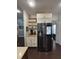 Stainless steel refrigerator with built-ins and open concept to living area at 5008 W W Liberty Meadows Dr, Summerville, SC 29485