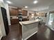 Well-equipped kitchen with granite countertops, dark wood cabinetry, stainless steel appliances, and a breakfast nook at 5008 W W Liberty Meadows Dr, Summerville, SC 29485