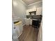 Well-organized laundry room with a washing machine, dryer, and storage cabinets at 5008 W W Liberty Meadows Dr, Summerville, SC 29485