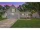 Charming two-story home with a manicured lawn and a two-car garage at 5052 Hidden Forest Ln, North Charleston, SC 29420