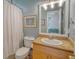 Bathroom with granite vanity, mirror, and shower with white curtain, with a view into the bedroom at 5084 Timber Race Crse, Hollywood, SC 29449