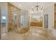 Spacious bathroom features stone floors, glass shower, and double vanity at 5084 Timber Race Crse, Hollywood, SC 29449