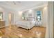 Bedroom with hardwood floors, tray ceilings, neutral walls, and lots of natural light at 5084 Timber Race Crse, Hollywood, SC 29449