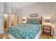Charming bedroom with wooden bed frame, matching side tables, and lamps at 5084 Timber Race Crse, Hollywood, SC 29449