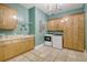 Bright laundry room with cabinets, counter space, and modern washer and dryer at 5084 Timber Race Crse, Hollywood, SC 29449