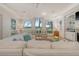 Bright living room with a large window view, light hardwood floors, and neutral furniture at 5084 Timber Race Crse, Hollywood, SC 29449