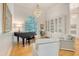 Bright and airy living room with a grand piano, comfortable seating, and stylish decor at 5084 Timber Race Crse, Hollywood, SC 29449