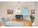 Cozy living room with hardwood floors, a beautiful chandelier, and ample natural light at 5084 Timber Race Crse, Hollywood, SC 29449