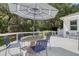 Outdoor living with deck, dining table, seating, and umbrella for relaxing or entertaining at 5084 Timber Race Crse, Hollywood, SC 29449