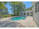 Inviting backyard pool area with lounge chairs and outdoor dining set at 5084 Timber Race Crse, Hollywood, SC 29449