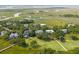 Aerial view of a coastal community with winding waterways, lush greenery, and a golf course at 55 Seagrass Ln, Isle of Palms, SC 29451
