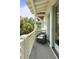 Inviting balcony with a chair to relax and enjoy the views and the white ceiling and porch at 55 Seagrass Ln, Isle of Palms, SC 29451