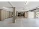 Spacious unfinished basement with concrete floors, cinder block supports, and ample lighting at 55 Seagrass Ln, Isle of Palms, SC 29451