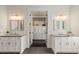 Elegant bathroom with double sinks, granite countertops, and a large closet at 55 Seagrass Ln, Isle of Palms, SC 29451