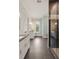 Bright bathroom showcasing double sinks, modern lighting, and walk-in shower at 55 Seagrass Ln, Isle of Palms, SC 29451