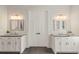 Stylish bathroom featuring double sinks, granite countertops, modern lighting, and tile floors at 55 Seagrass Ln, Isle of Palms, SC 29451