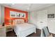 Bedroom features wood floors, windows, and accent wall at 55 Seagrass Ln, Isle of Palms, SC 29451