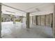 Large open garage space with neutral tones, storage, and a glimpse of the outdoors with the door open at 55 Seagrass Ln, Isle of Palms, SC 29451