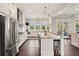 Spacious kitchen features stainless appliances, a large island, plenty of cabinets, and an outdoor view at 55 Seagrass Ln, Isle of Palms, SC 29451