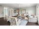 Cozy living room featuring neutral furniture, a ceiling fan, and a decorative map on a light blue wall at 55 Seagrass Ln, Isle of Palms, SC 29451