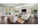Comfortable living room with white furniture, ship lap wall, and natural light flowing from French doors at 55 Seagrass Ln, Isle of Palms, SC 29451