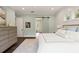 The main bedroom includes hardwood floors, a barn door, a large dresser, and is well-lit with natural light at 55 Seagrass Ln, Isle of Palms, SC 29451