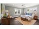 This main bedroom is decorated with blue walls and has many windows offering lots of natural light at 55 Seagrass Ln, Isle of Palms, SC 29451