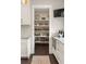 Well-organized walk-in pantry with ample shelving and storage space for food and appliances at 55 Seagrass Ln, Isle of Palms, SC 29451