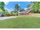 Expansive backyard with lush green lawn, mature trees, and a paved patio area perfect for outdoor living at 703 Temple Rd # A, Ladson, SC 29456
