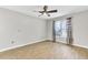 Bright, airy bedroom with wood floors, ceiling fan, and a large window at 703 Temple Rd # A, Ladson, SC 29456